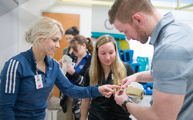 Students working in an occupational therapy simulation
